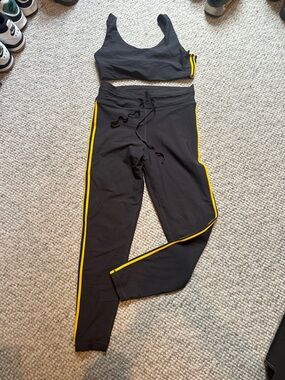 The Upside SET Black Leggings and top with Yellow Logo Detail